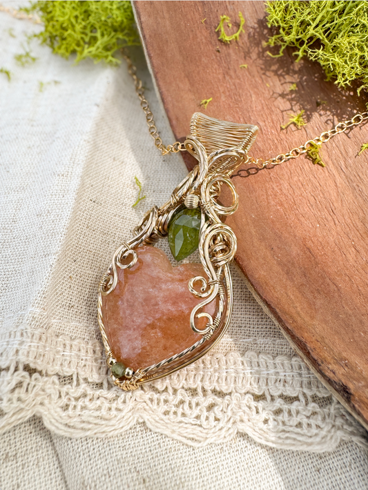 Necklace with a large brown stone pendant on a textured fabric background